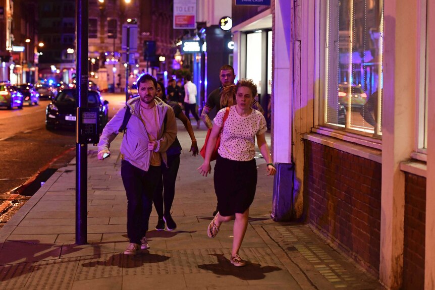 People run down Borough High Street as police are dealing with a "major incident" at London Bridge.