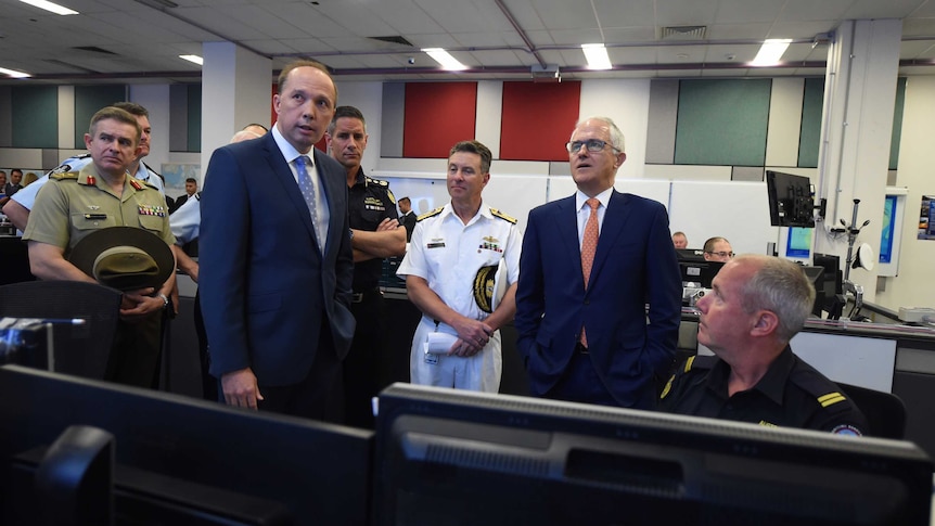Prime Minister Turnbull and Peter Dutton on a tour of Australian Maritime Border Command Centre in Canberra.