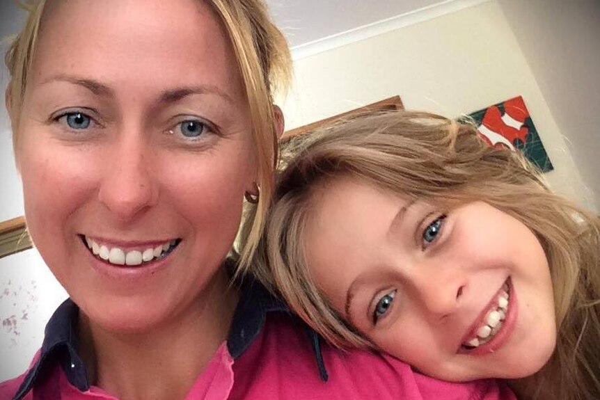 Photo of mum Brydie and her 9 year old daughter smiling at the camera