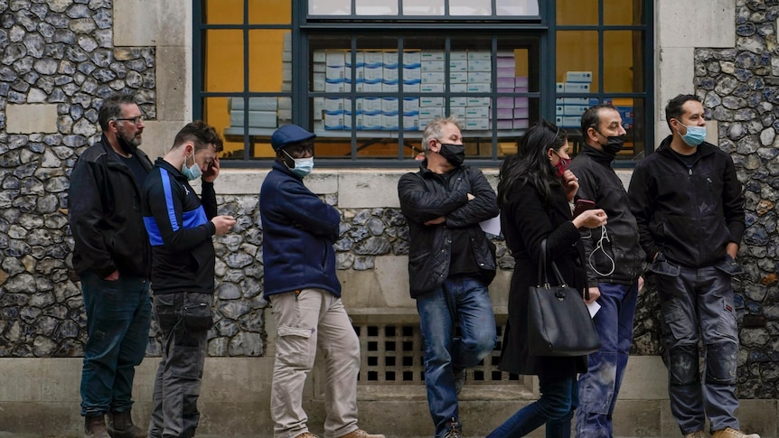 People waiting in line to get a COVID test