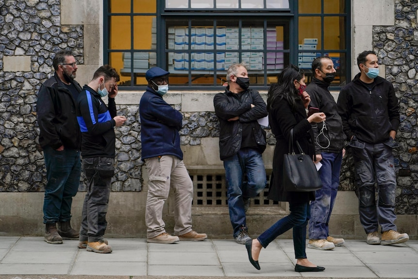 People waiting in line to get a COVID test