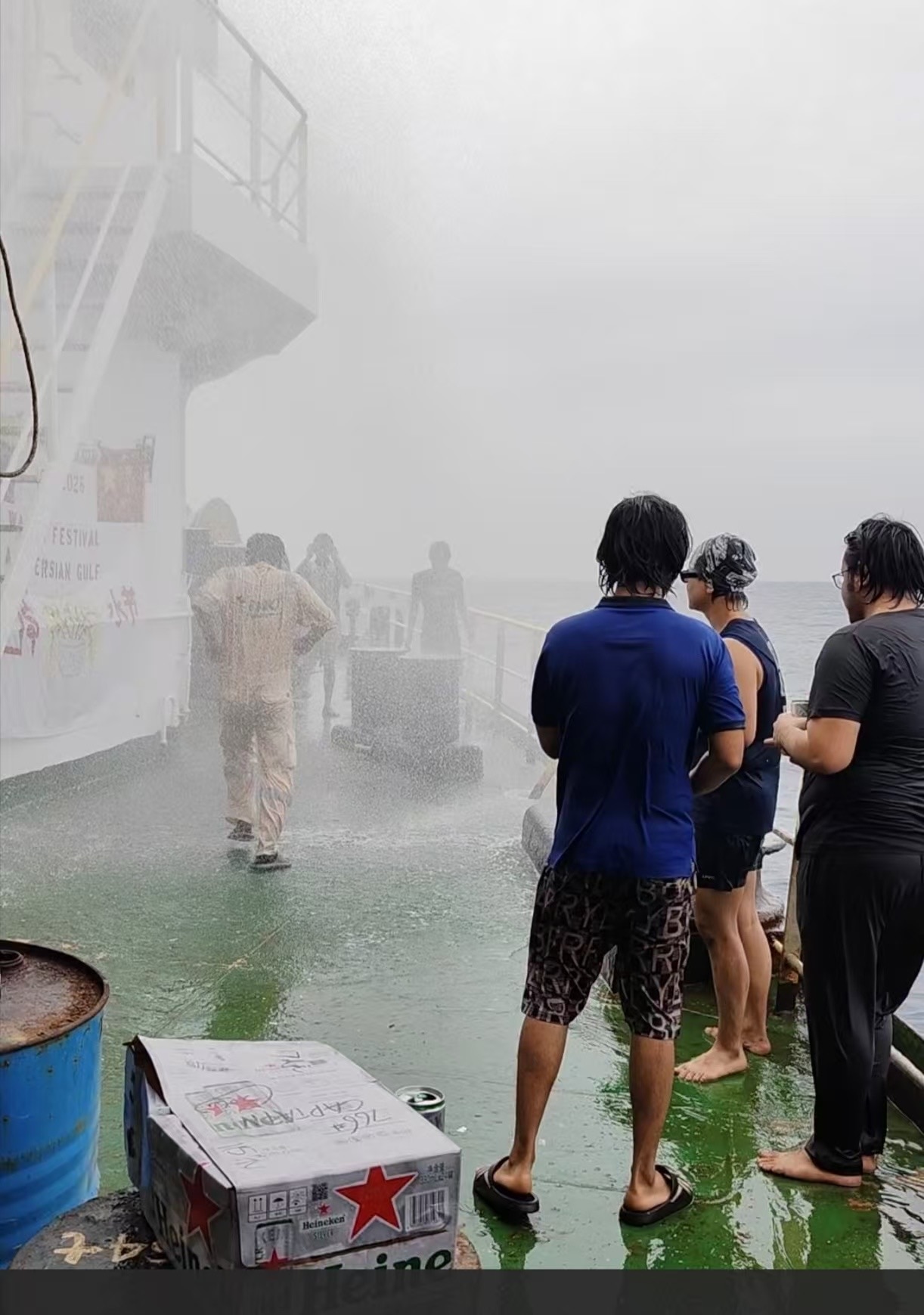People splashed with water and all wet.