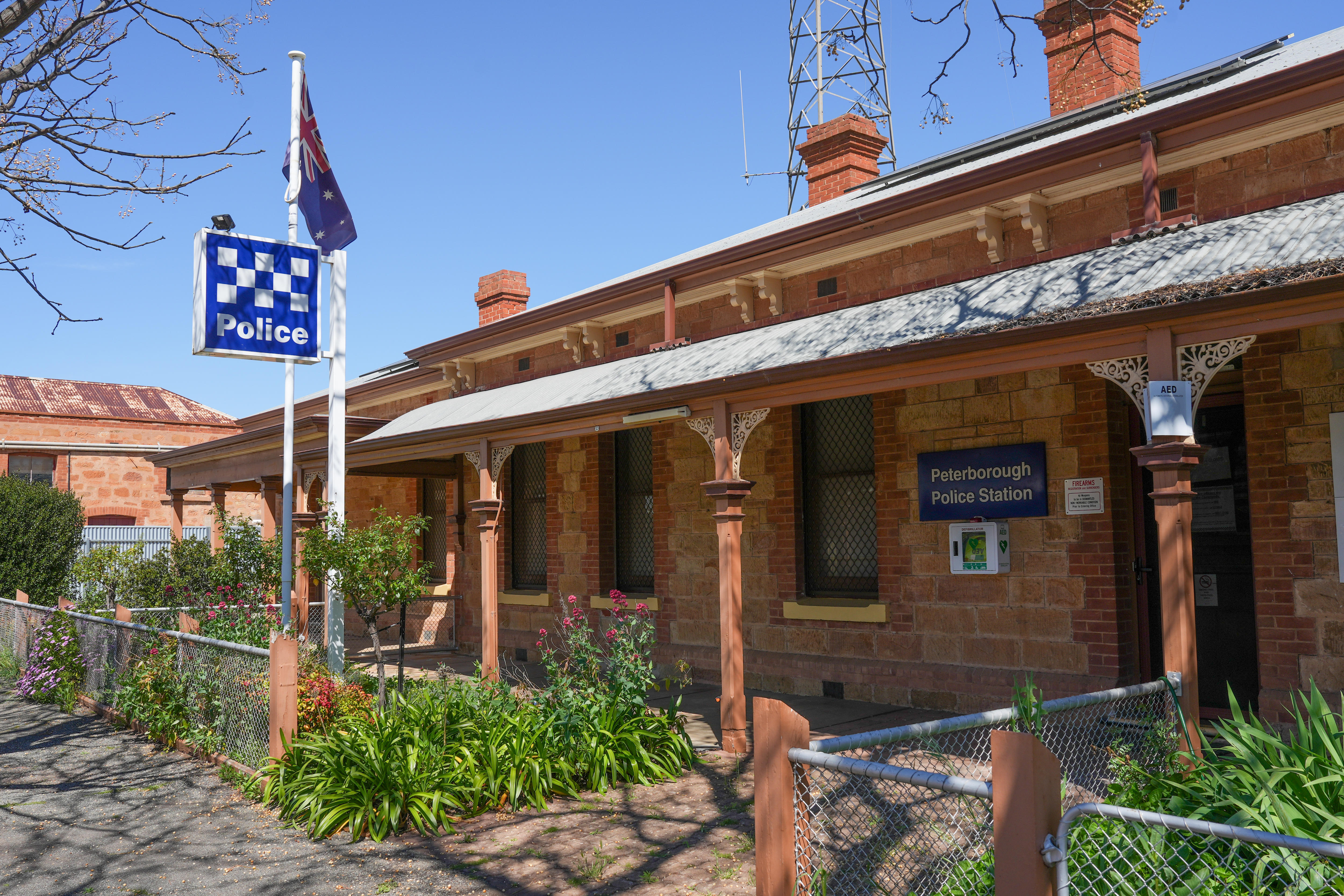 External image of the Peterborough Police Station in a red brick cottage in South Australia.