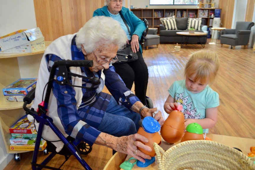 Aged care patients play with children in Wellington