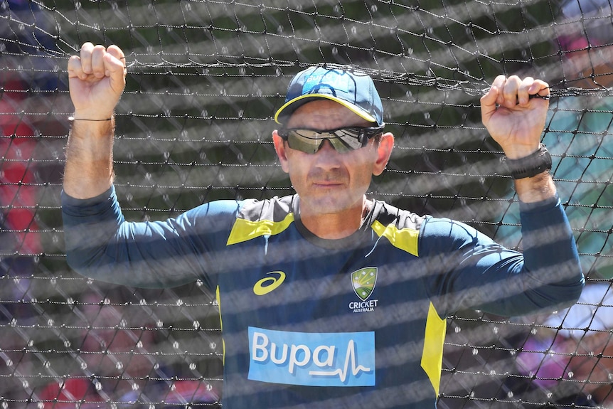 Justin Langer watches Australia training