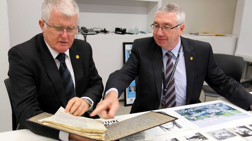 Major Crimes Superintendent Des Bray reviews the police file with a fellow officer.