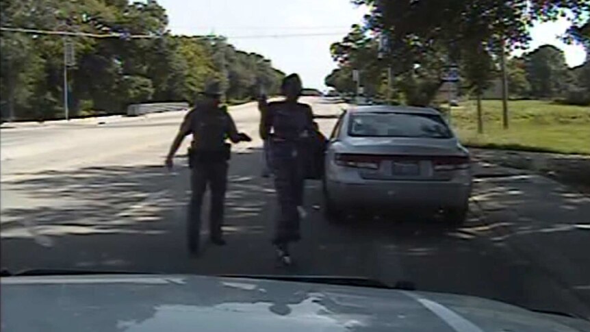 US police officer Brian Encinia points a Taser at Sandra Bland