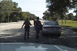 US police officer Brian Encinia points a Taser at Sandra Bland