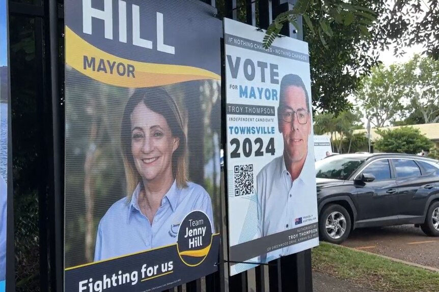 Two election signs outside a polling booth
