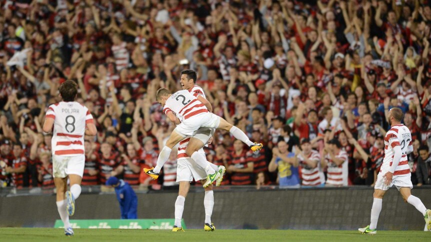 What a screamer ... Rocky Visconte celebrates the Wanderers' third goal.