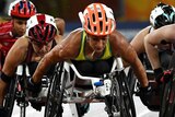 Three Australians are out in front of a wheelchair sprint race.