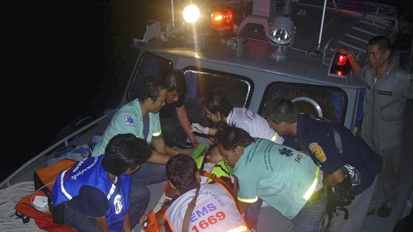 Rescue workers carry an injured victim to a hospital