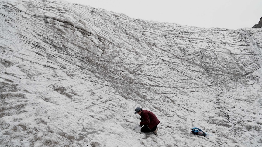 PHD student Chen Jizu measures coal dust on a glacier