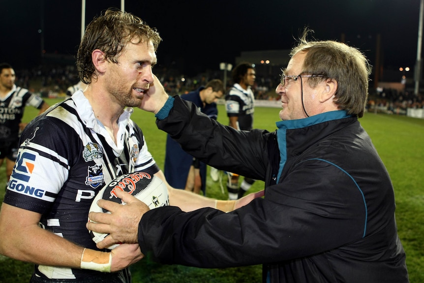 Brett Hodgson receives the match ball from Tommy Raudonikis