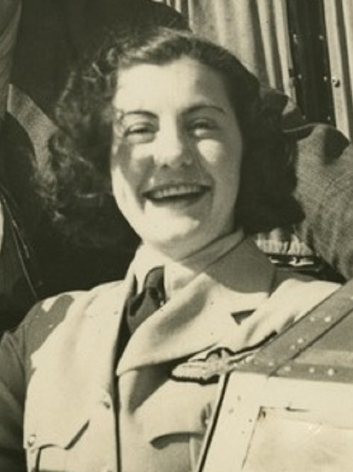 Ivy May Pearce smiles wearing a uniform.