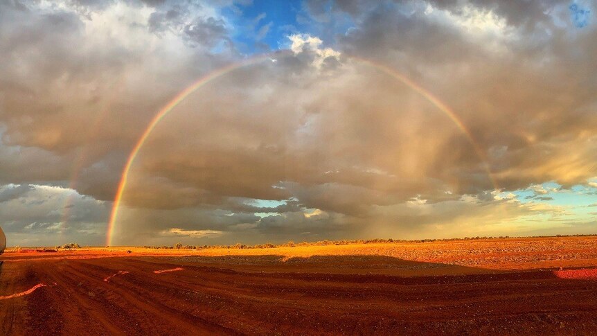 A rainbow over the Donohoe Highway, outside of Boulia, near the border in western Queensland
