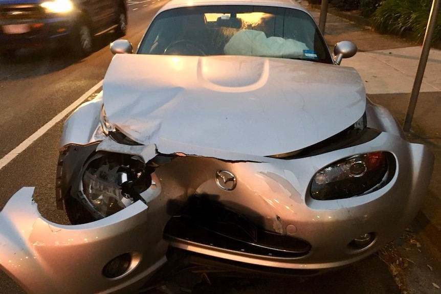 Car with smashed front hood.