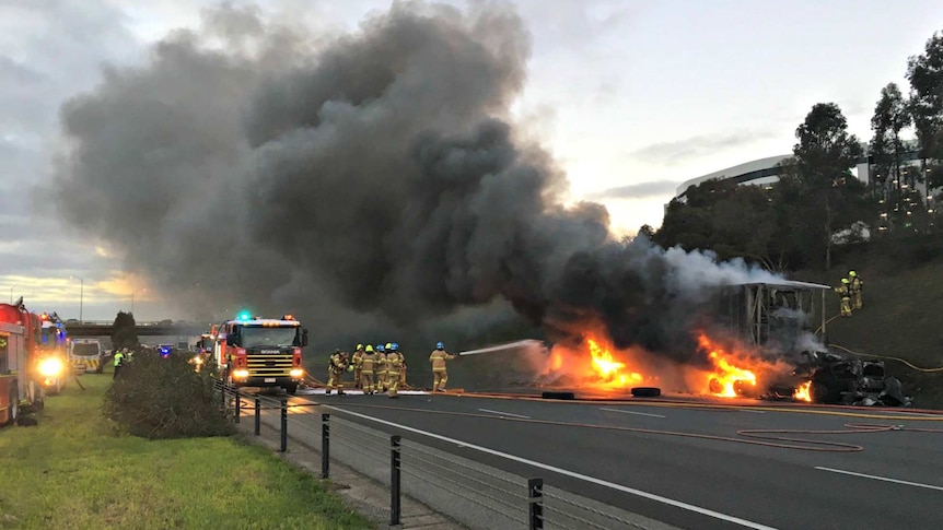 Truck on fire on Melbourne's Monash freeway sends plume of smoke into the air