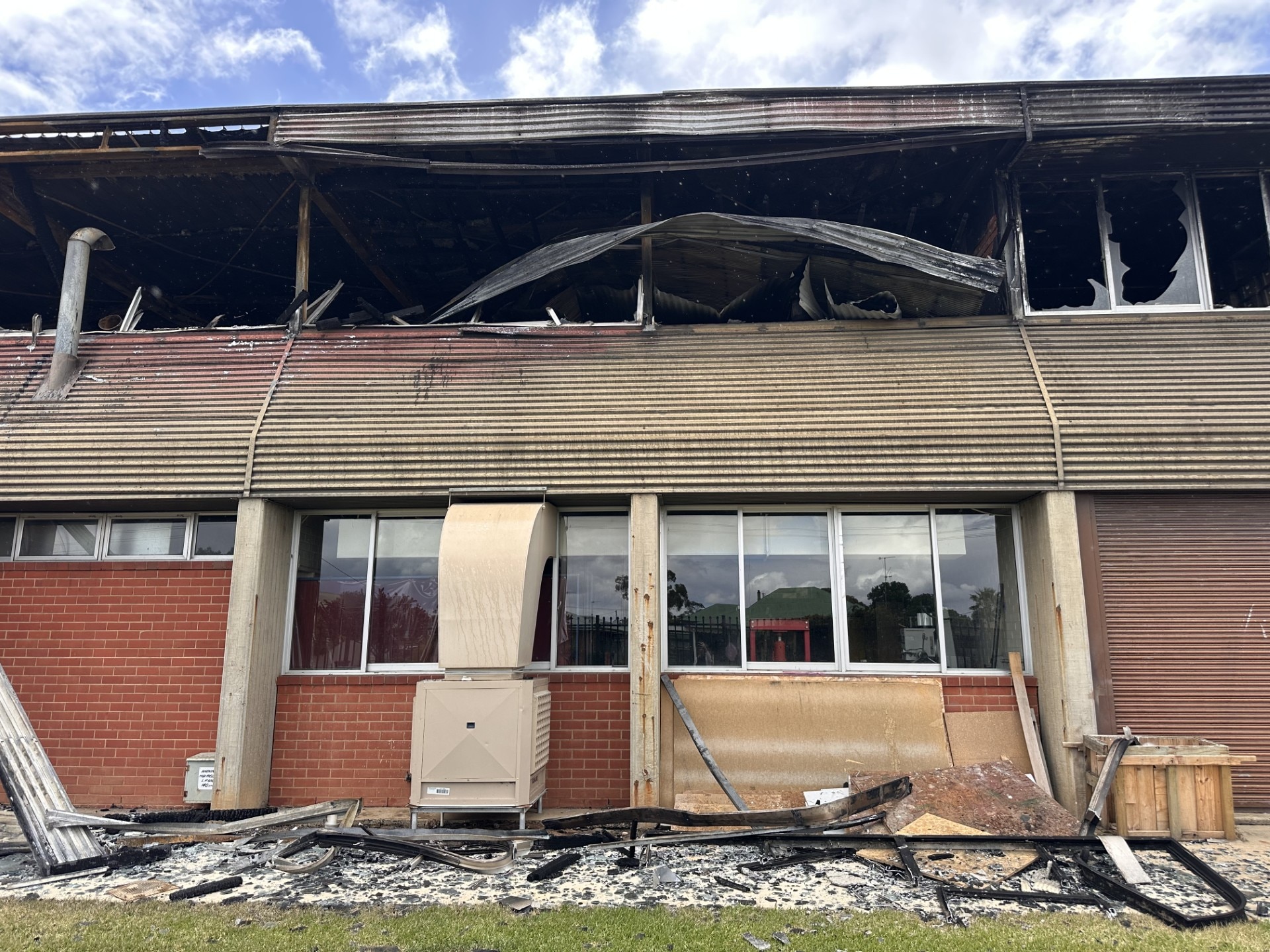 Fire-damaged two-storey building at a high school.