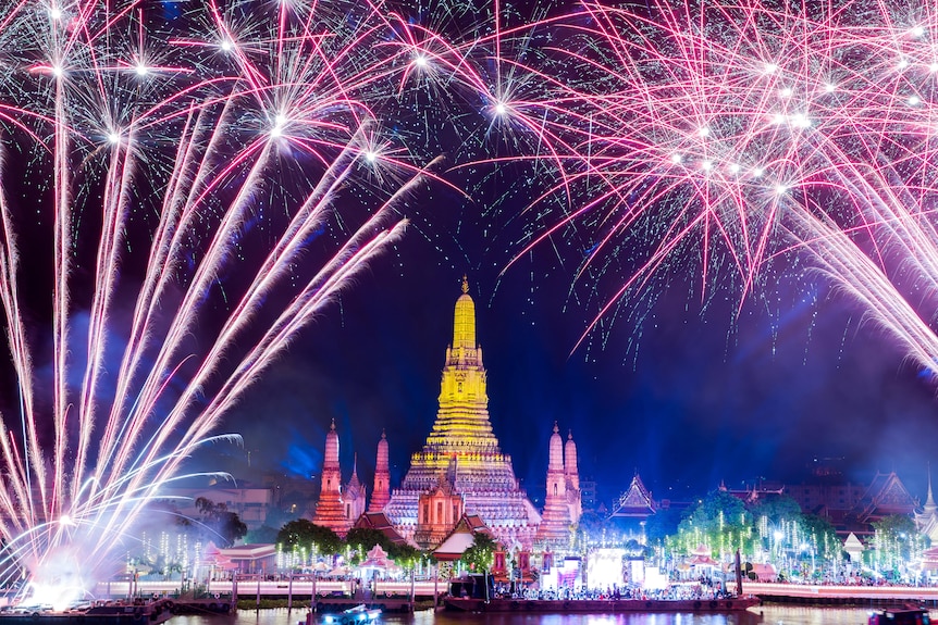 Fireworks explode over Wat Arun of the temple of dawn during the New Year celebrations, in Bangkok.