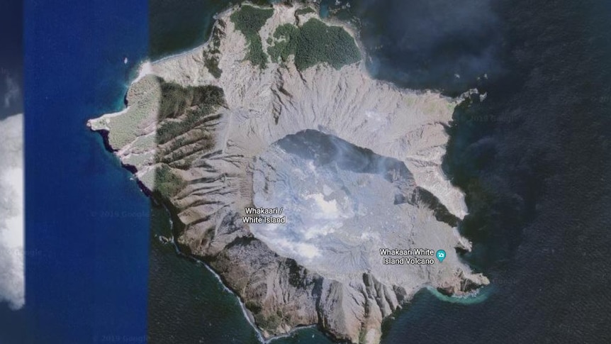 A satellite image of a volcano island from above.