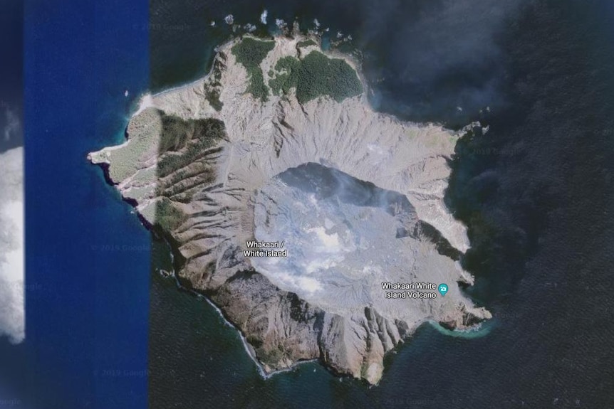 A satellite image of a volcano island from above.