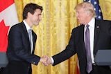 President Donald Trump (right) and Canadian Prime Minister Justin Trudeau (left) shake hands