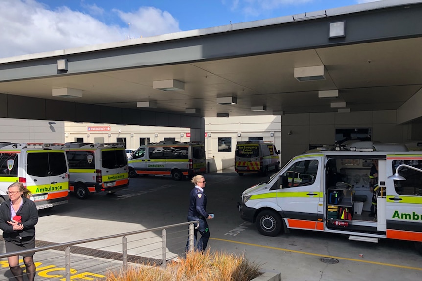 Ambulances wait outside the Launceston General Hospital