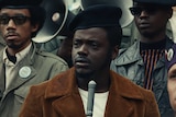 Actor Daniel Kaluuya as Fred Hampton, in a crowd of Black Panthers, in the film Judas and the Black Messiah