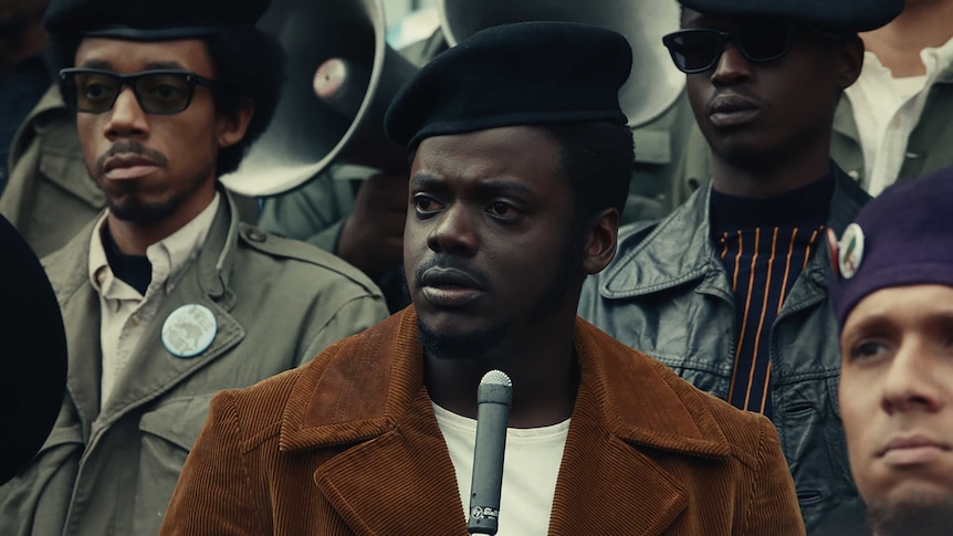 Actor Daniel Kaluuya as Fred Hampton, in a crowd of Black Panthers, in the film Judas and the Black Messiah
