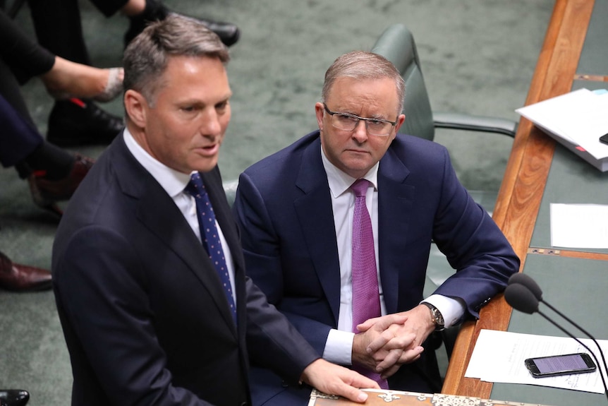 Richard Marles stands at the despatch box in the House of Representatives, as Anthony Albanese looks on