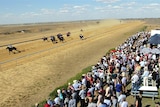Crowd watches a horse race at Longreach.