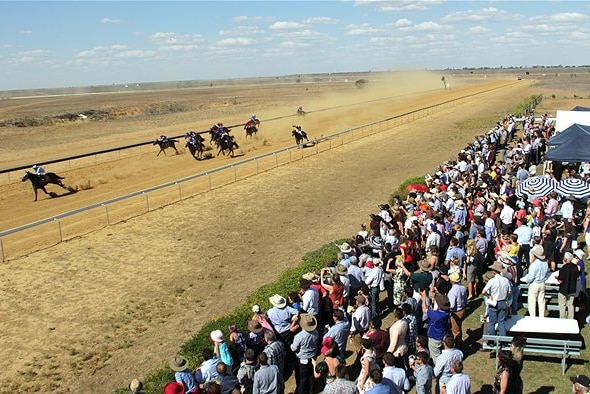 Crowd watches a race at the 125th anniversary of racing in Longreach.