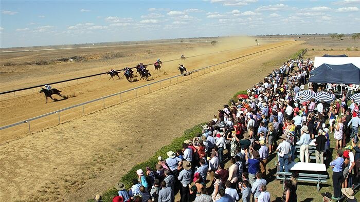 Crowd watches a horse race at Longreach.