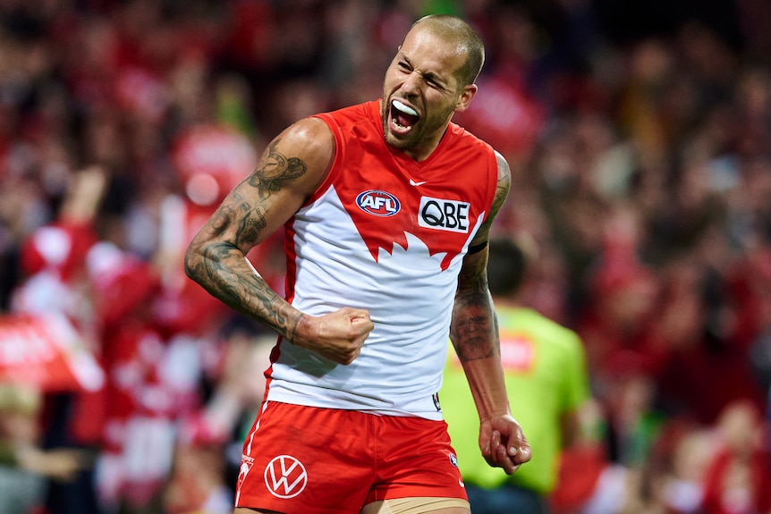 Lance Franklin clenches his fist and yells in delight