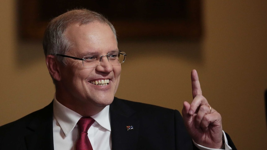 Scott Morrison smiling, pointing up