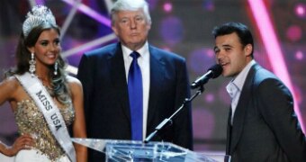 Donald Trump stands with the miss usa contenstant of the miss universe pageant.