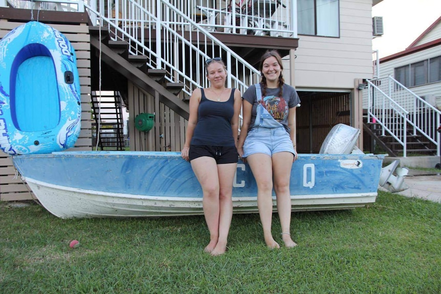 Homeowner Tiffany Swadling (on left) has her boat ready to go outside her Depot Hill home.