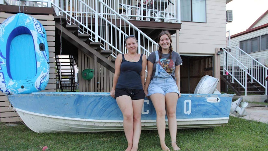 Homeowner Tiffany Swadling (on left) has her boat ready to go outside her Depot Hill home.