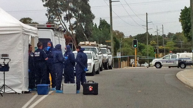 Police officers gather evidence