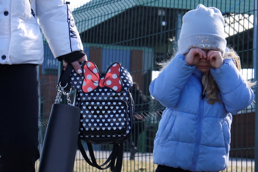 People cross the border between Poland and Ukraine