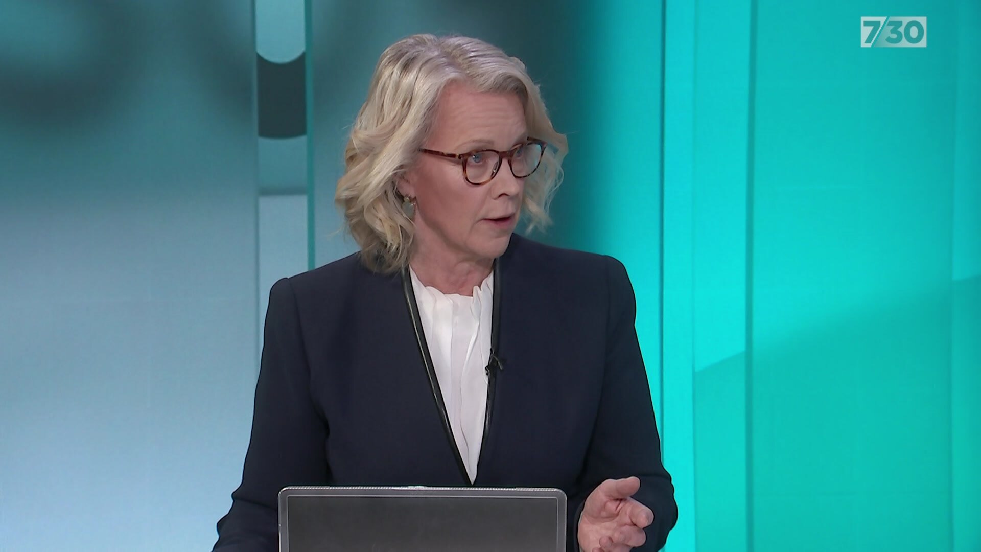 Laura Tingle on the set of 7.30 looking off-camera.