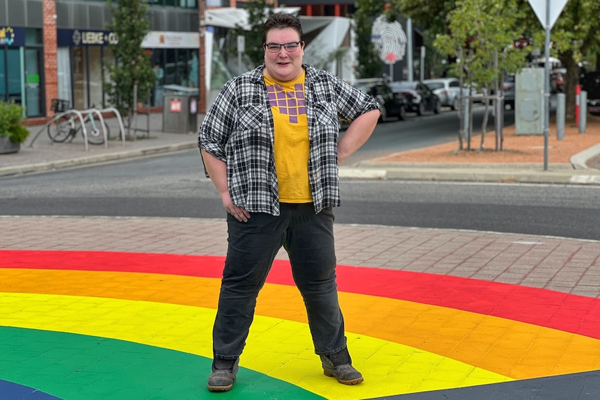 A person at Braddon's iconic rainbow roundabout.