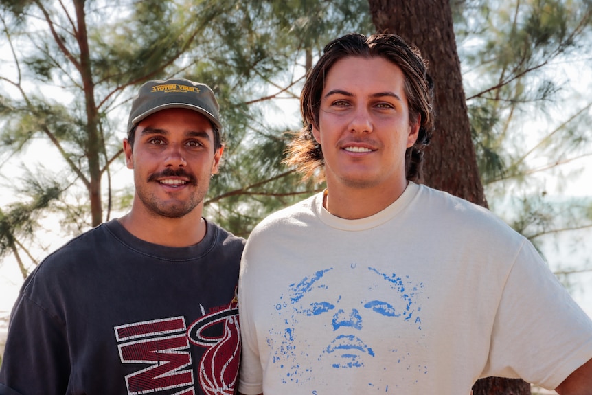 two young aboriginal men smiling