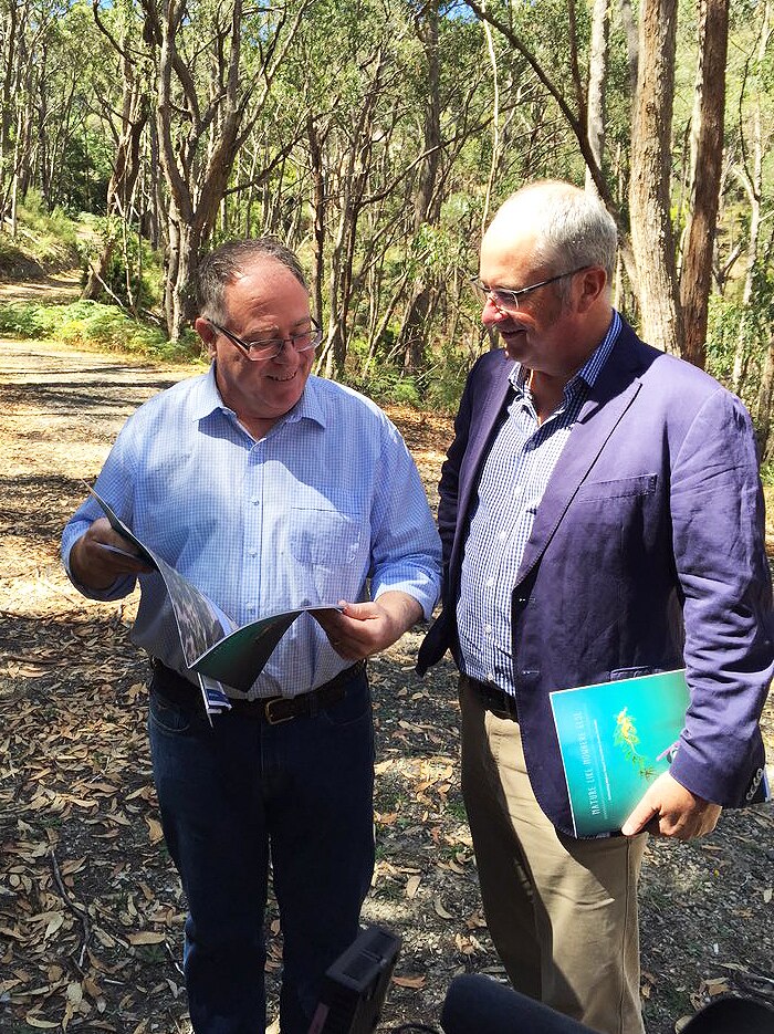 Minister Ian Hunter and Leon Bignell launch the strategy on a bush track in the Adelaide Hills.