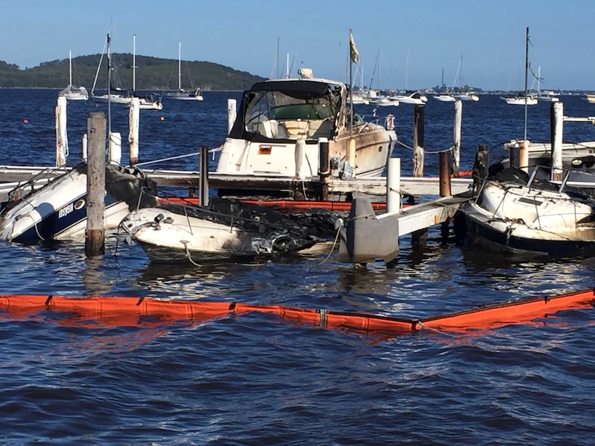 A fire destroys three boats at a Lake Macquarie marina