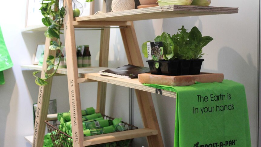 An exhibit at the 2017 Waste Conference with the slogan 'The Earth is in your hands".