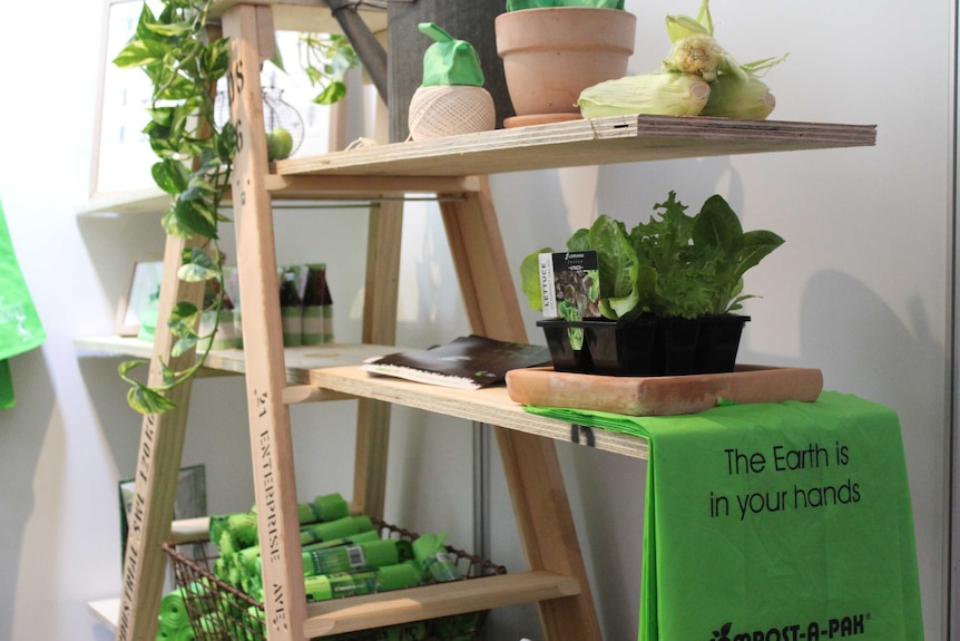 An exhibit at the 2017 Waste Conference with the slogan 'The Earth is in your hands".