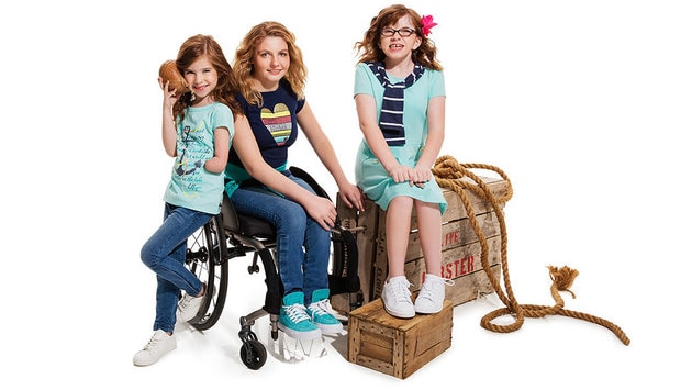 Photos of young girls wearing the adaptive clothing range