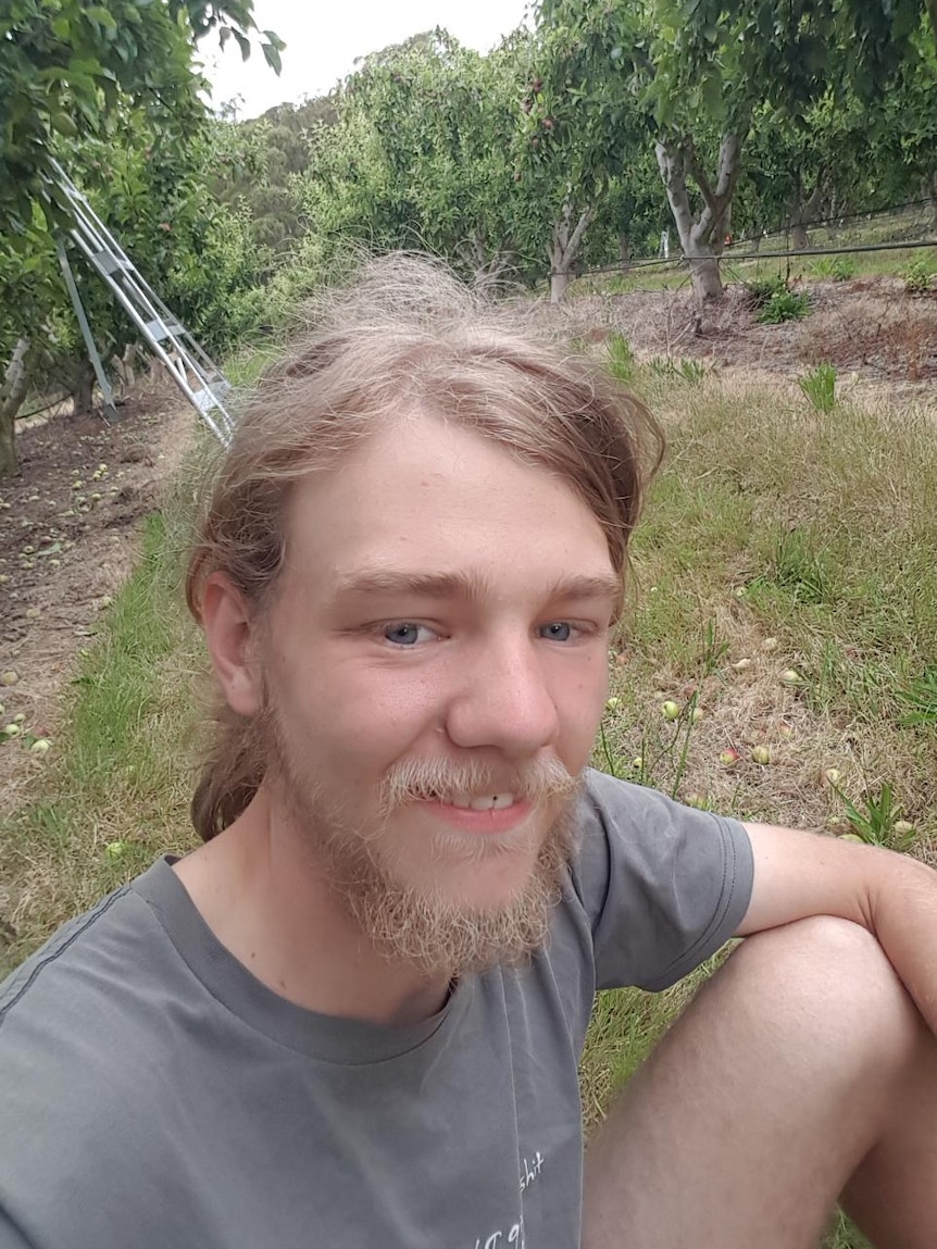 A man sitting on the ground.